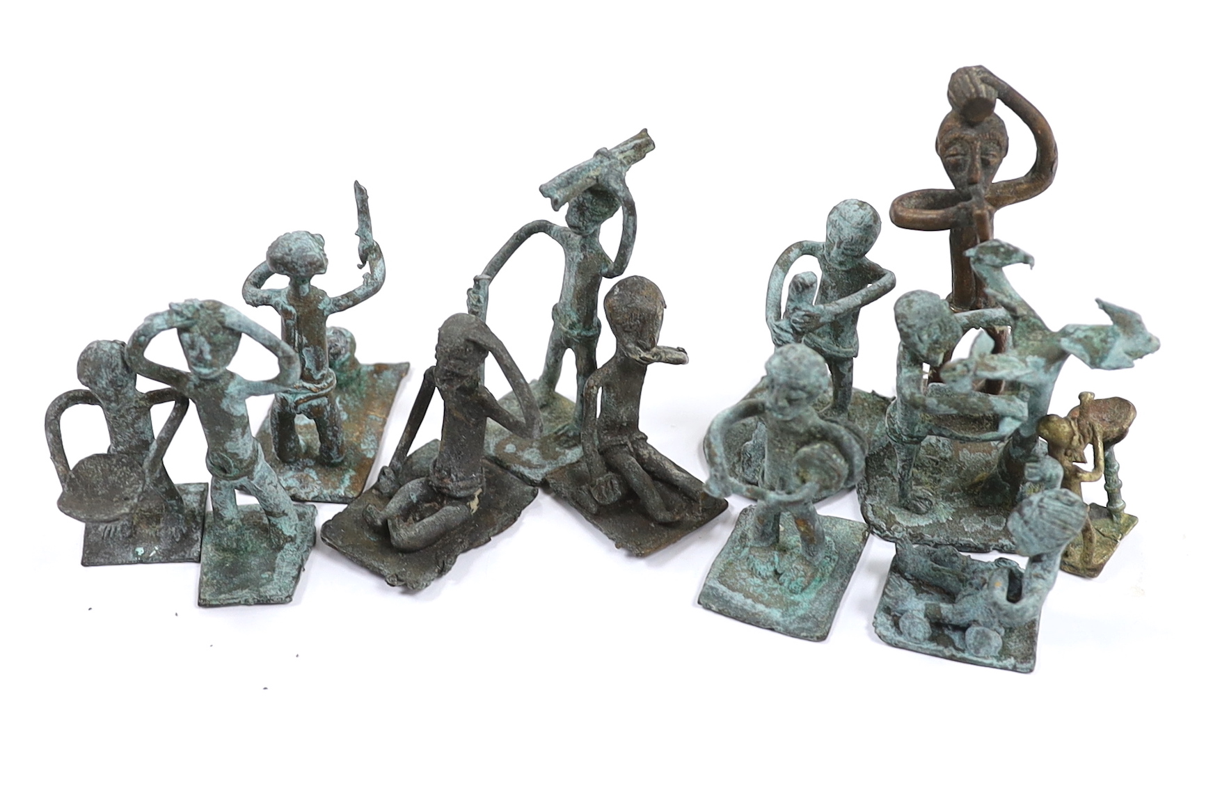 A collection of 20th century West African bronze figures, possibly gold weights, Ghana, Akan, box inscribed ‘West Africa. Gold Coast - attained in 1944 (Ghana)’, tallest 8.5cm